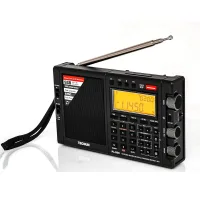 Tecsun PL-990 ön panel: tuş takımı, ayar düğmeleri ve turuncu aydınlatmalı ekran